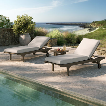 Saratoga teak wood 3-piece chaise lounge set with light gray cushions on a stone patio on Tampa Home & Garden Store
