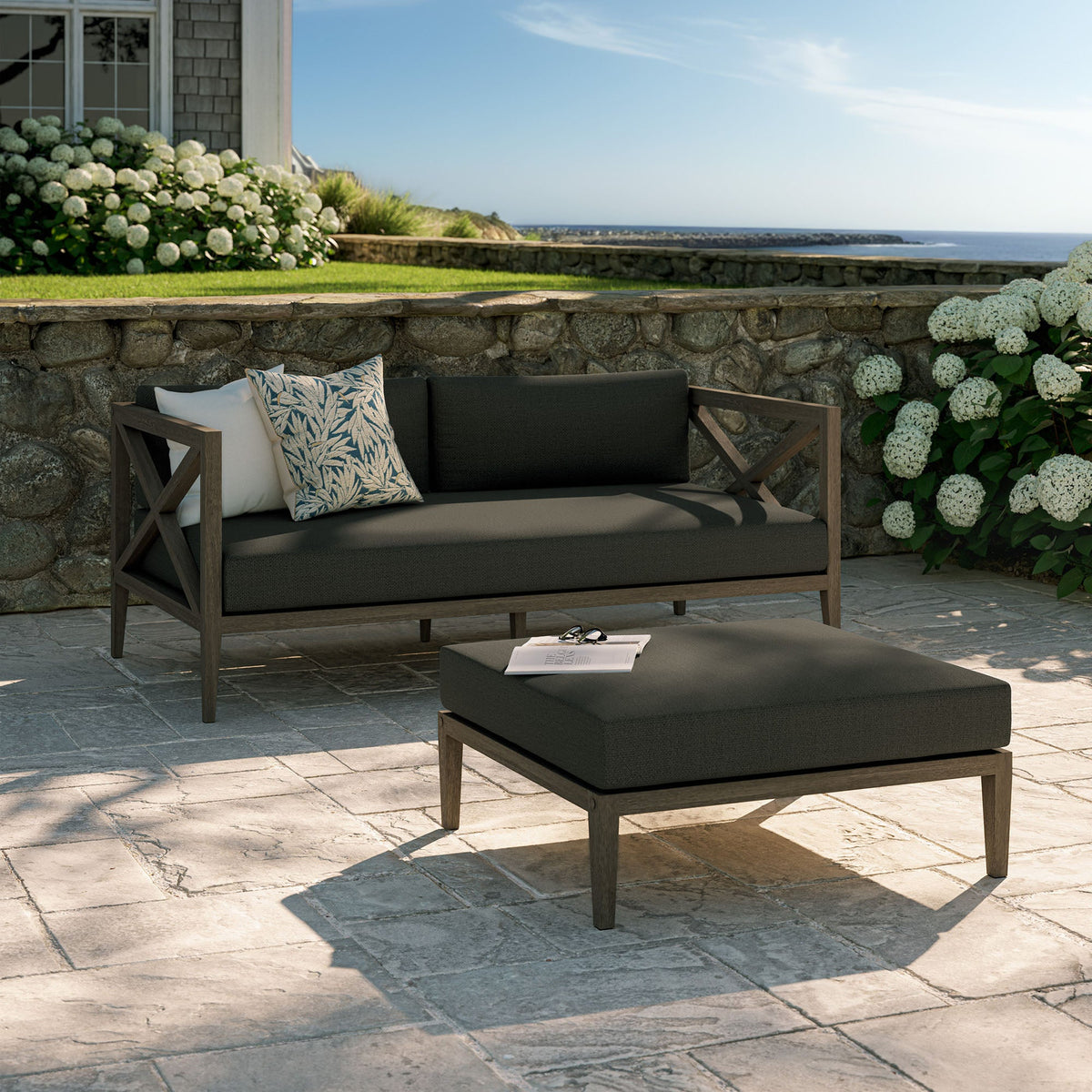 Northlake teak wood outdoor loveseat and ottoman set with charcoal cushions on Tampa Home & Garden Store