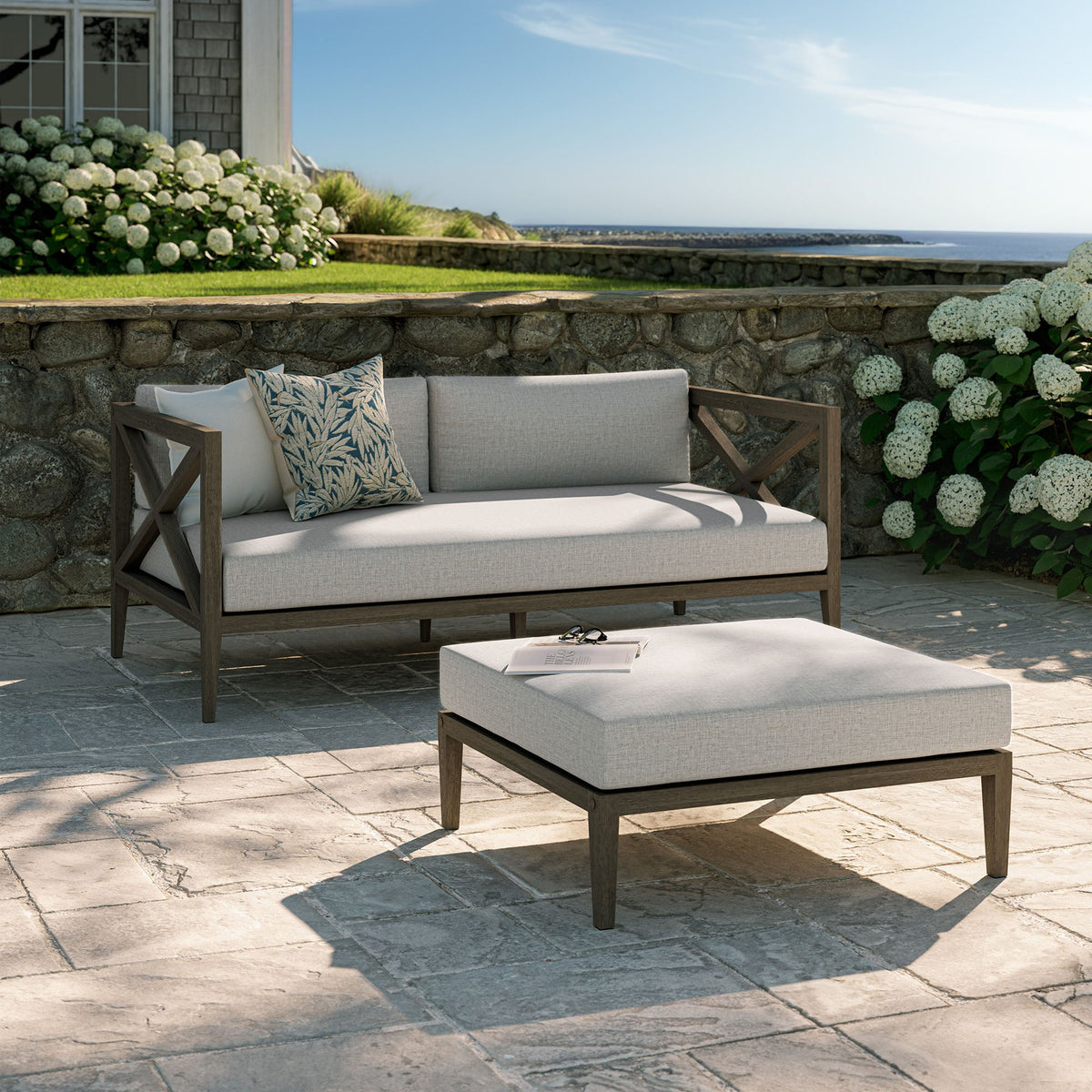 Northlake two-piece teak wood loveseat and ottoman set with gray cushions, oceanside patio on Tampa Home & Garden Store