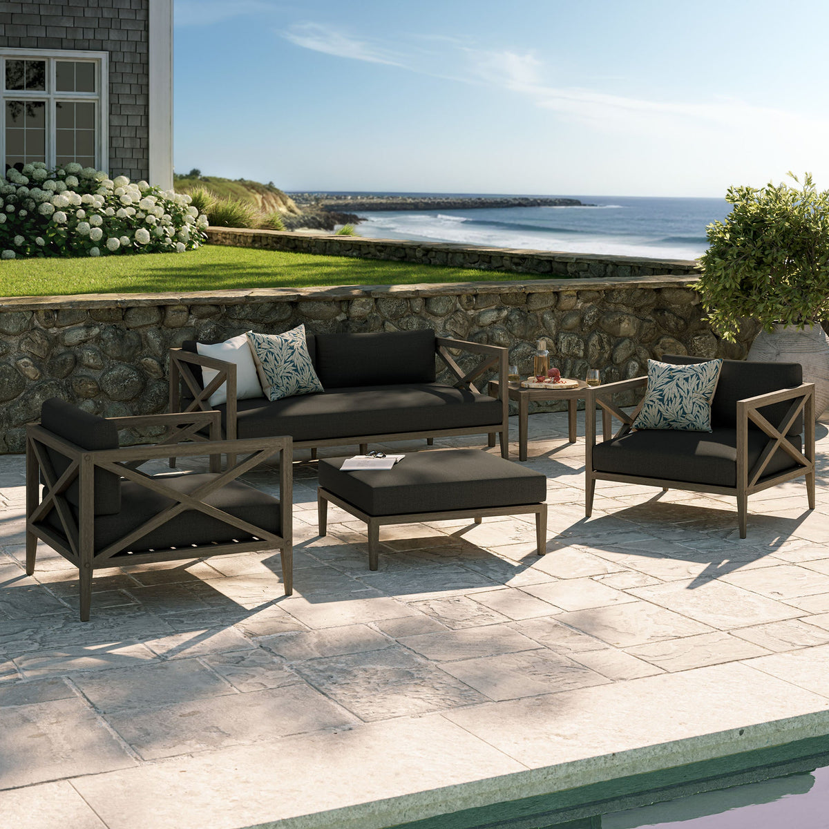 Northlake 5-Piece outdoor teak wood furniture set with dark cushions on a terrace by the ocean on Tampa Home & Garden Store