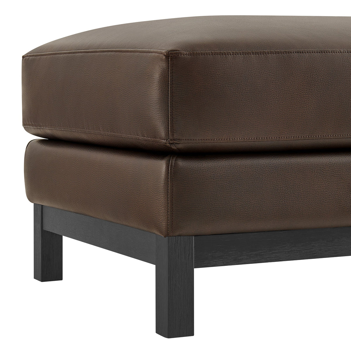 Roscoe vegan leather ottoman in warm brown with stitched panels and black wood legs on Tampa Home & Garden Store