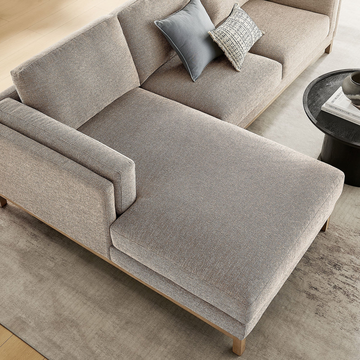 Roscoe left-facing beige fabric sectional with chaise and blue-gray pillows on Tampa Home & Garden Store