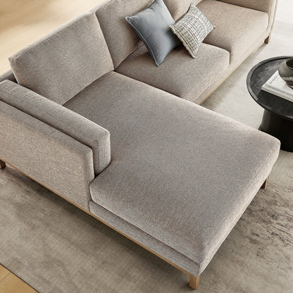 Roscoe left-facing beige fabric sectional with chaise and blue-gray pillows on Tampa Home & Garden Store