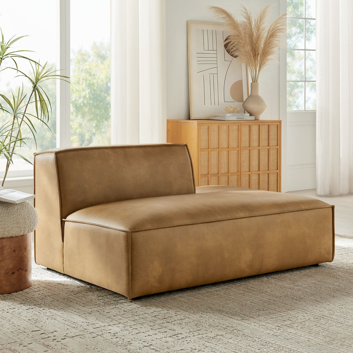 Restore Vegan Leather Right-Facing Armless Modular Chaise in tan with clean seams in living room on Tampa Home & Garden Store