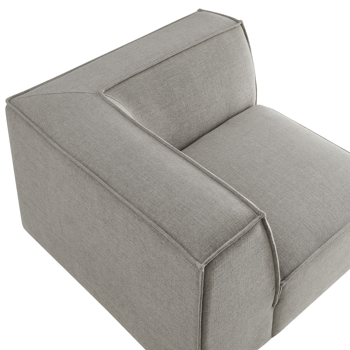 Modular corner chair in light gray performance fabric with piped edges on Tampa Home & Garden Store