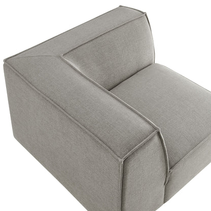 Modular corner chair in light gray performance fabric with piped edges on Tampa Home & Garden Store