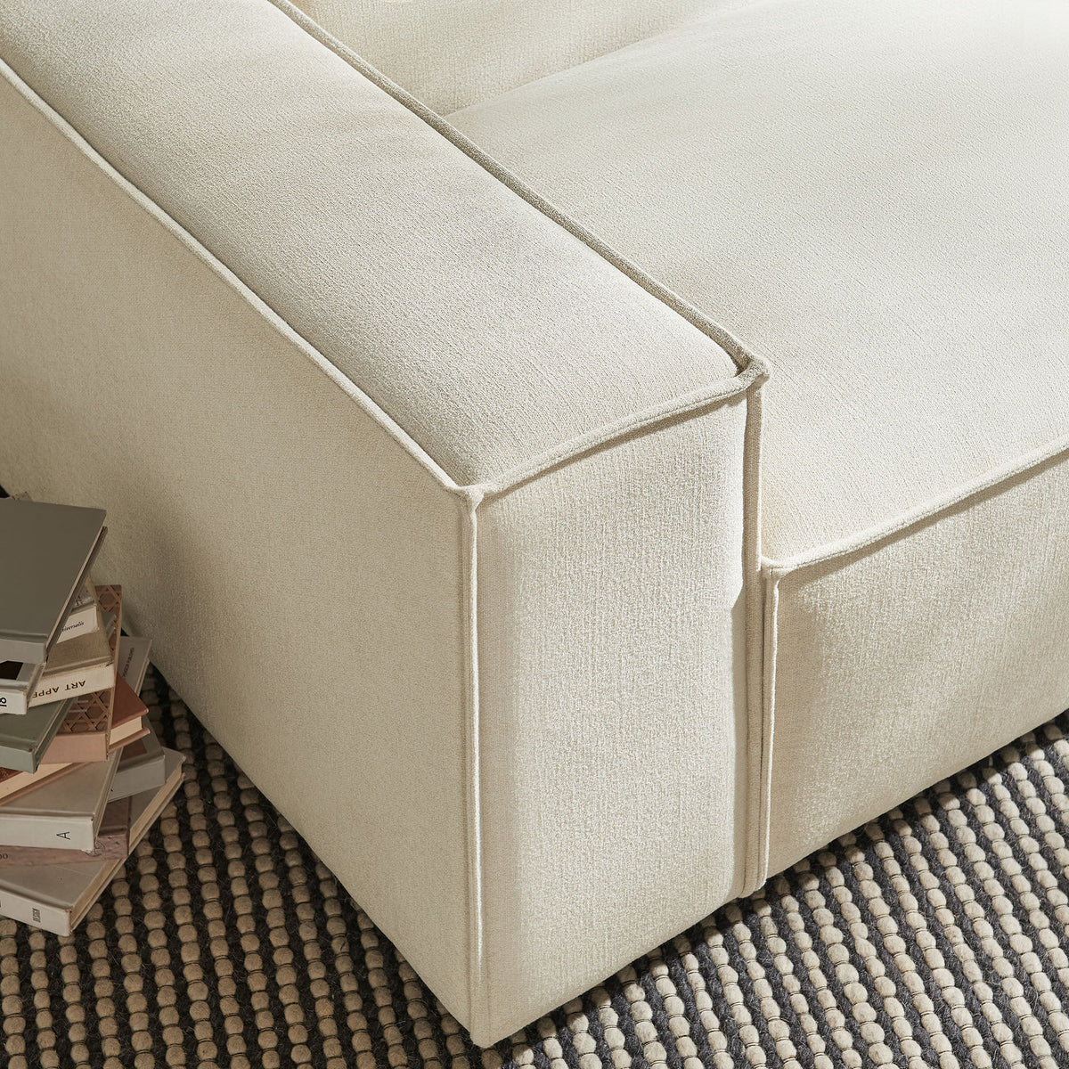 Left-facing modular lounge chair in beige performance fabric with piped seams on Tampa Home & Garden Store