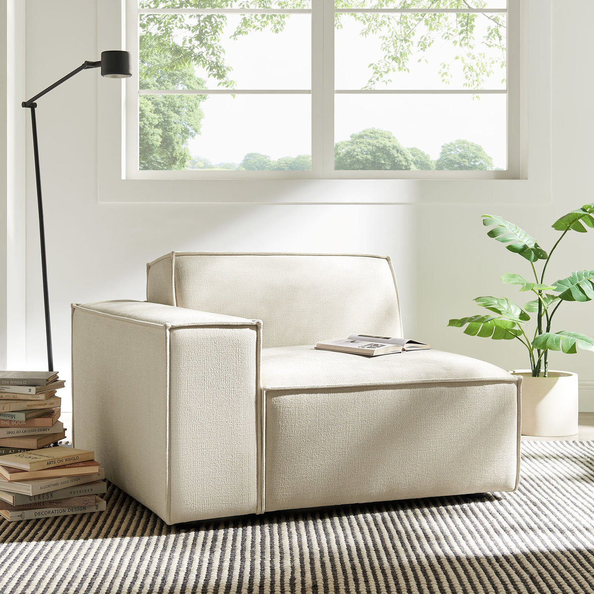 Left-facing modular lounge chair in beige Restore performance fabric by Modway in a bright living room on Tampa Home & Garden Store