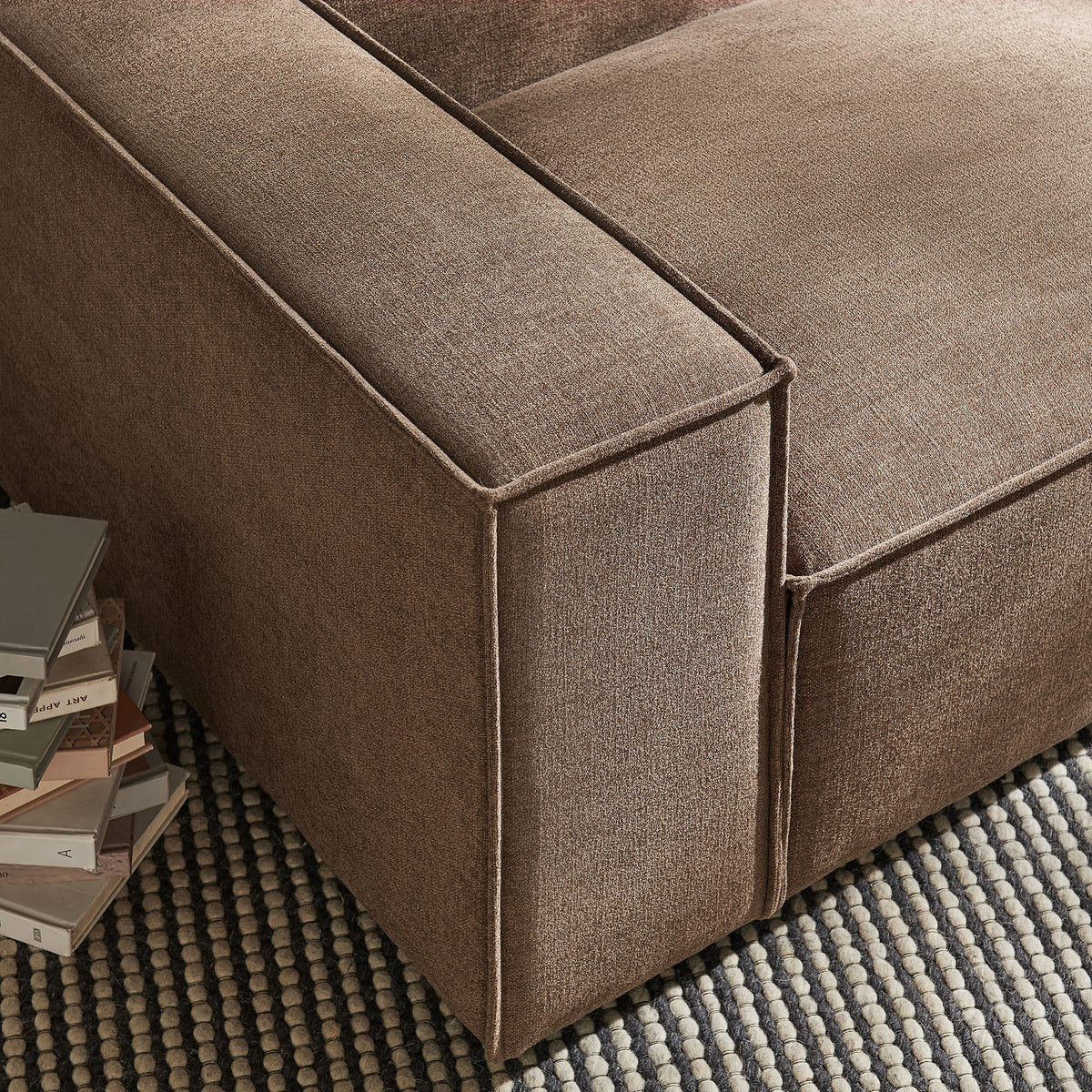 Left-facing modular lounge chair in brown performance fabric with visible seams on Tampa Home & Garden Store