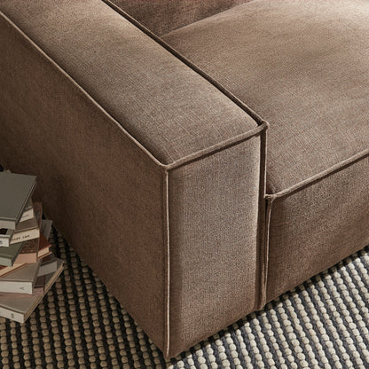 Left-facing modular lounge chair in brown performance fabric with visible seams on Tampa Home & Garden Store