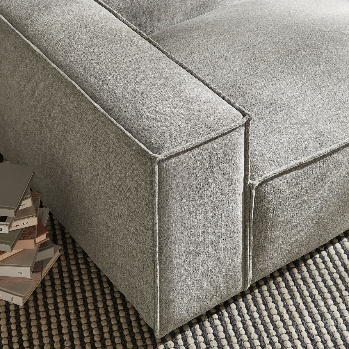 Left-facing modular lounge chair in gray Restore Performance fabric with piping on Tampa Home & Garden Store