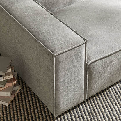 Left-facing modular lounge chair in gray Restore Performance fabric with piping on Tampa Home & Garden Store