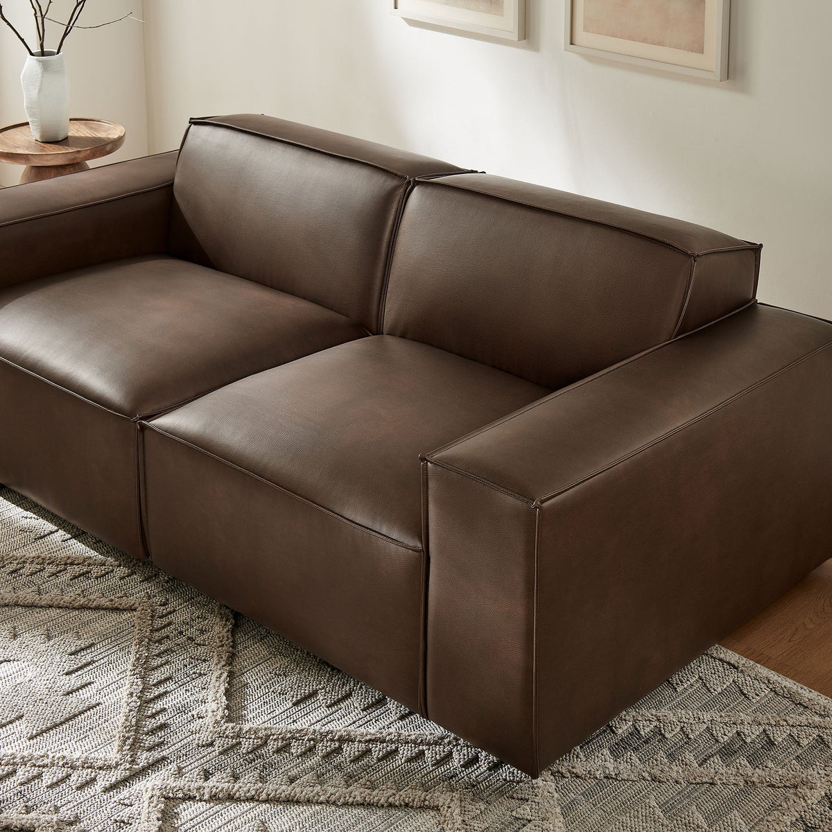 Restore 2-Piece vegan leather modular loveseat in espresso brown with clean stitching on Tampa Home & Garden Store