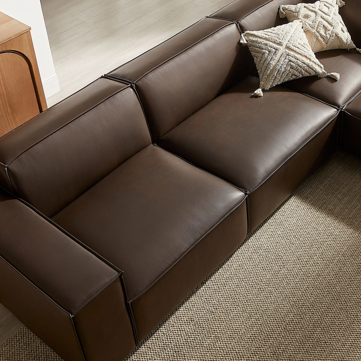 Restore 5-Piece vegan leather modular L-shaped sofa in brown with tassel pillows on Tampa Home & Garden Store