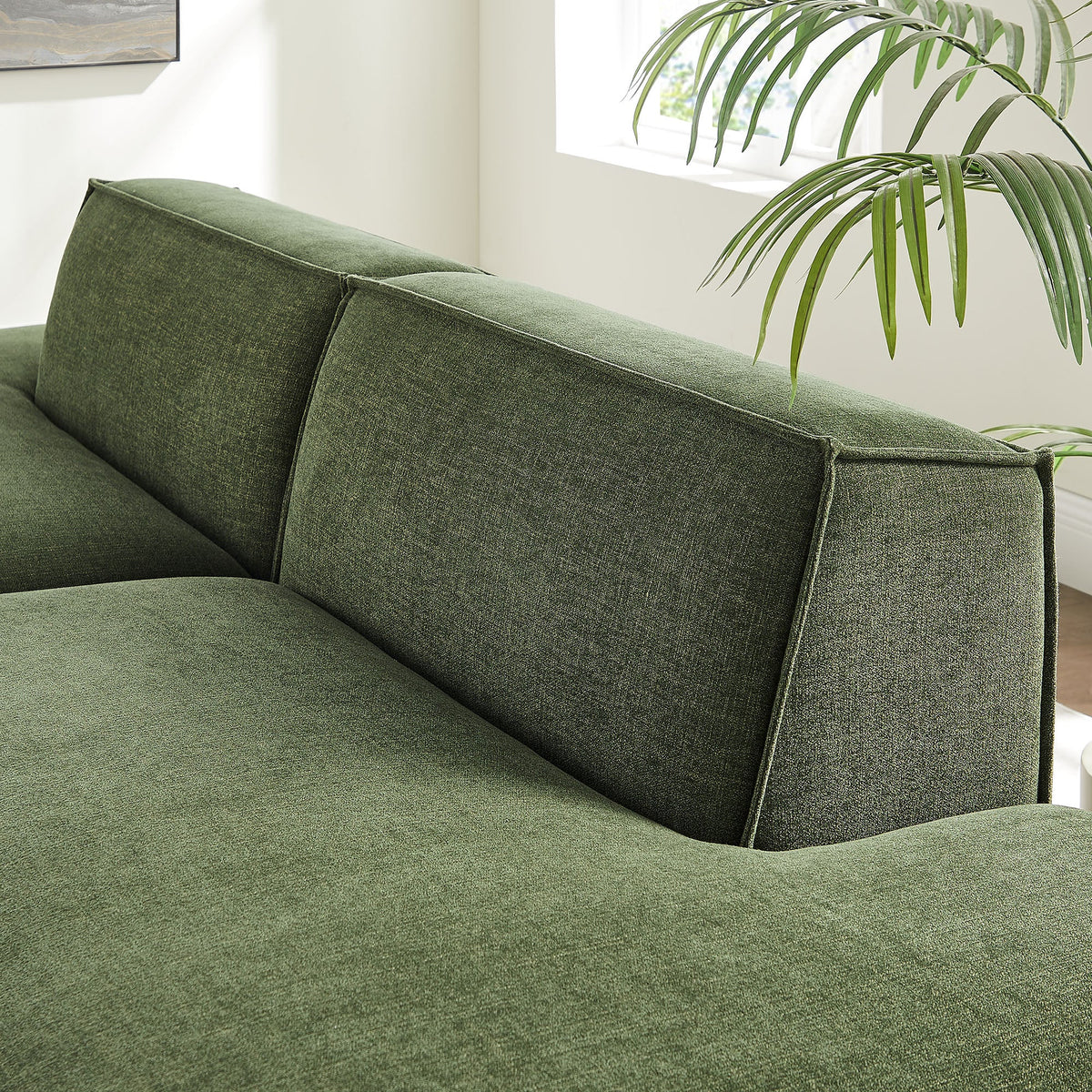 Modular loveseat in green performance fabric with textured weave and stitched cushions on Tampa Home & Garden Store