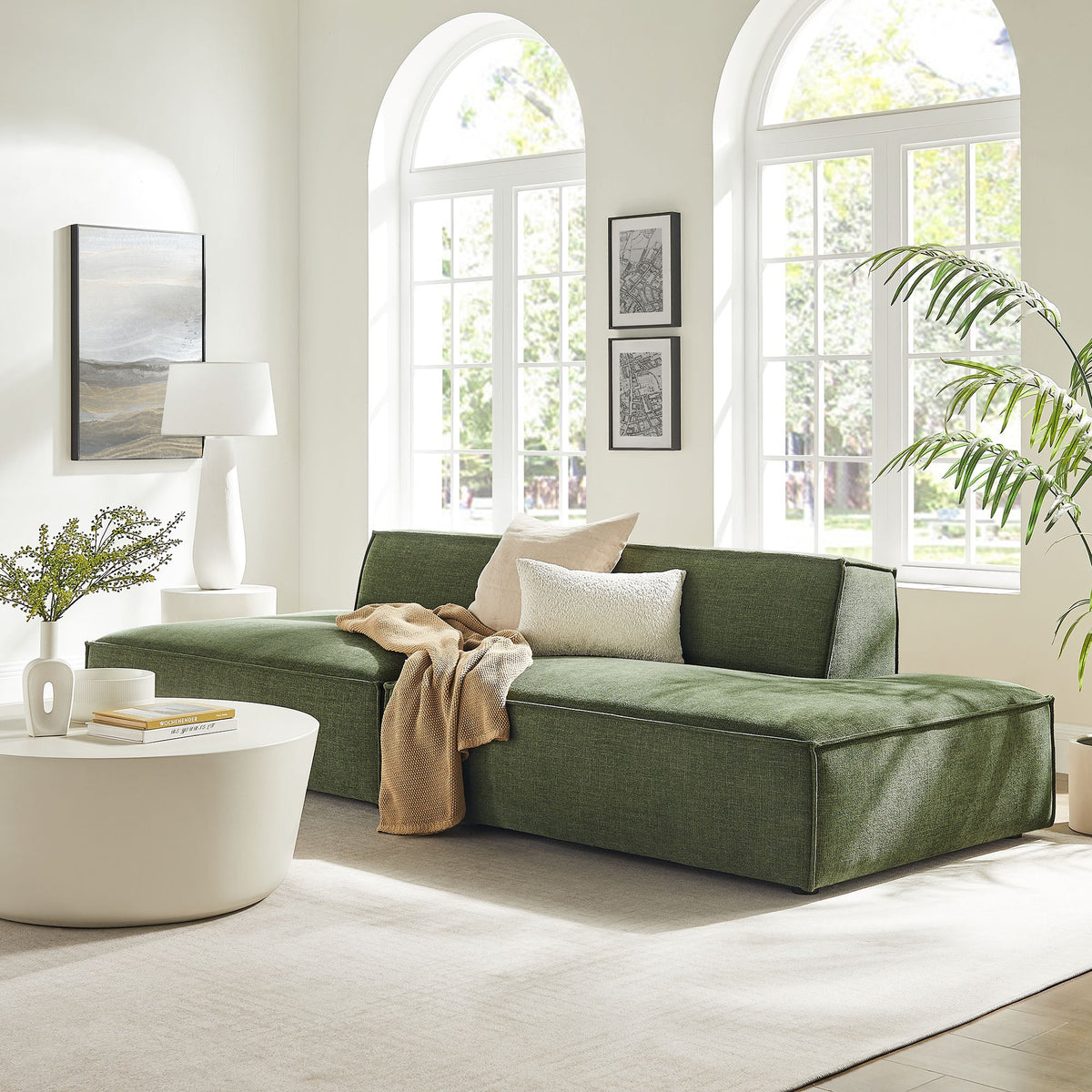 Restore 2-Piece Modular Loveseat in foliage green performance fabric with beige pillows in room on Tampa Home & Garden Store