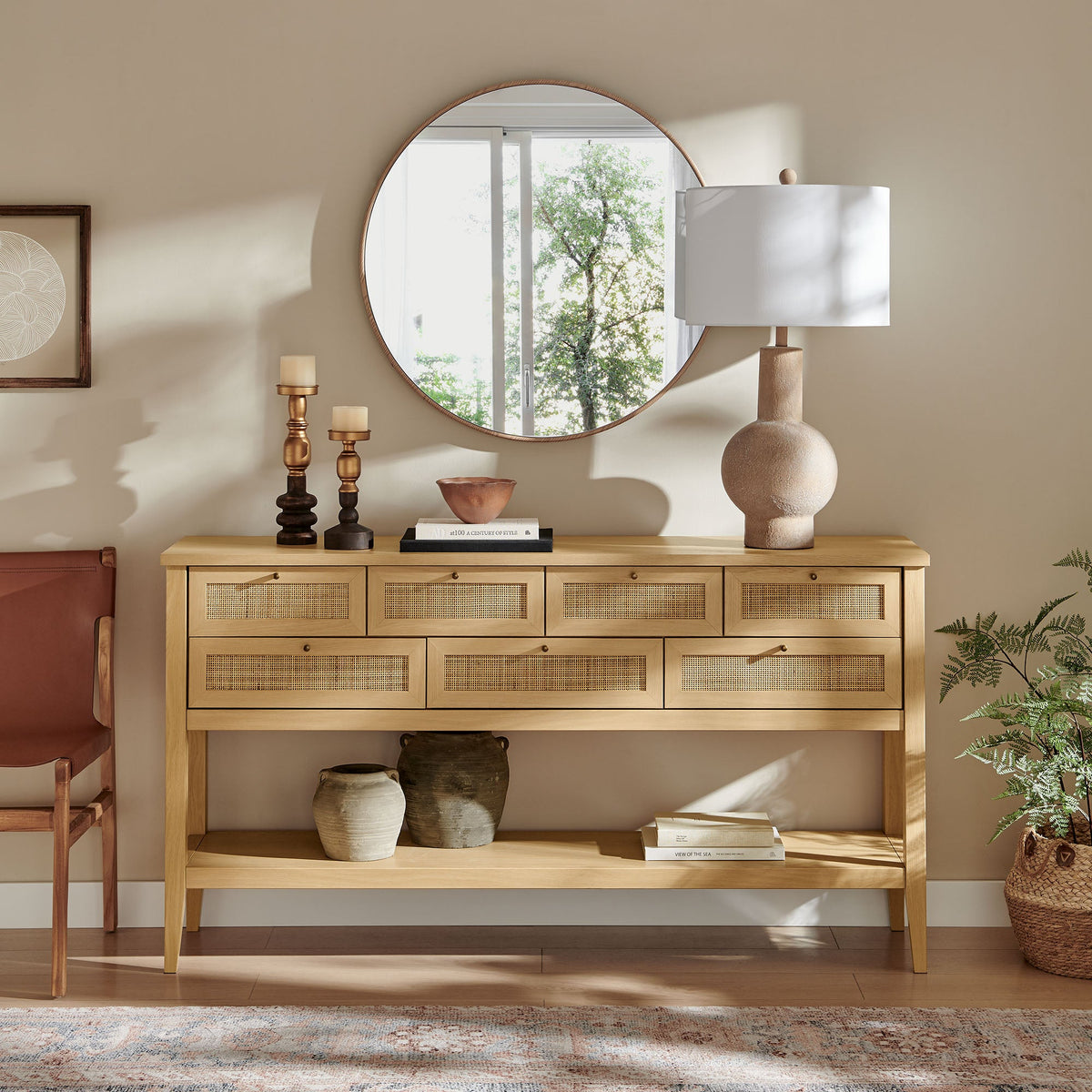Soma 62 Inch Rattan Console Table in natural wood with cane-front drawers and round mirror on Tampa Home & Garden Store