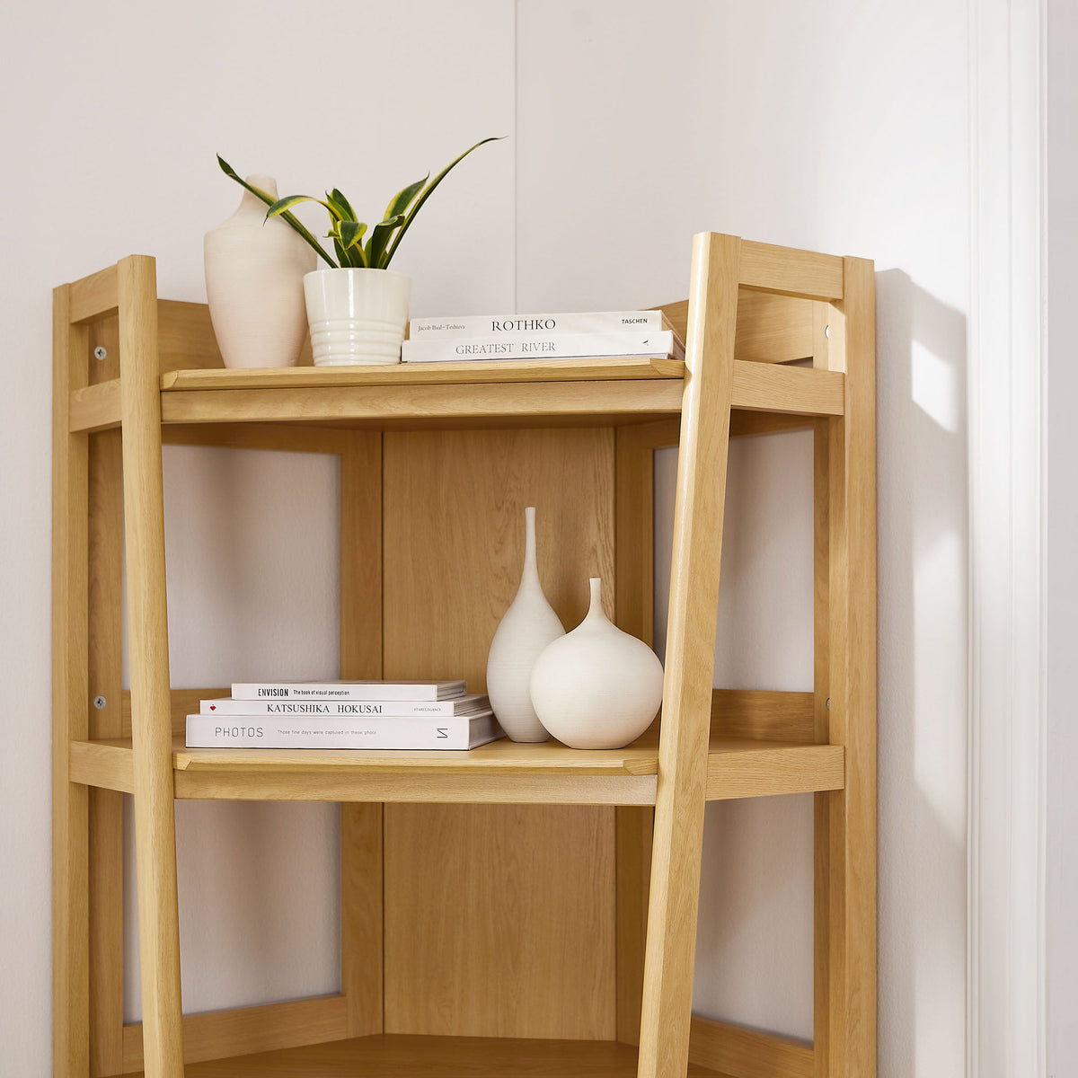 Bixby 71 Inch Corner Bookshelf by Modway in light wood with plant, books, and white vases on Tampa Home & Garden Store