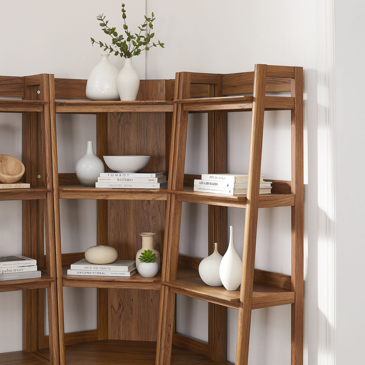 Bixby 3-piece corner bookshelf set with narrow shelves in warm wood, styled with white vases and books on Tampa Home & Garden Store