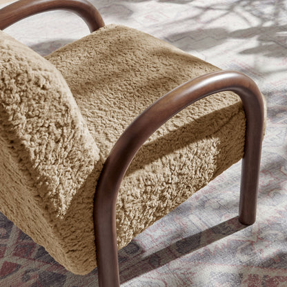 Lunet faux shearling armchair with beige plush upholstery and curved wood arms on rug on Tampa Home & Garden Store