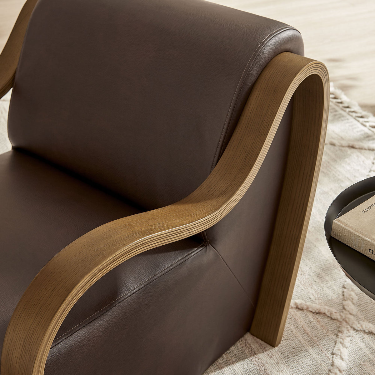 Atrium vegan leather accent armchair with dark brown upholstery and curved light wood arms on Tampa Home & Garden Store