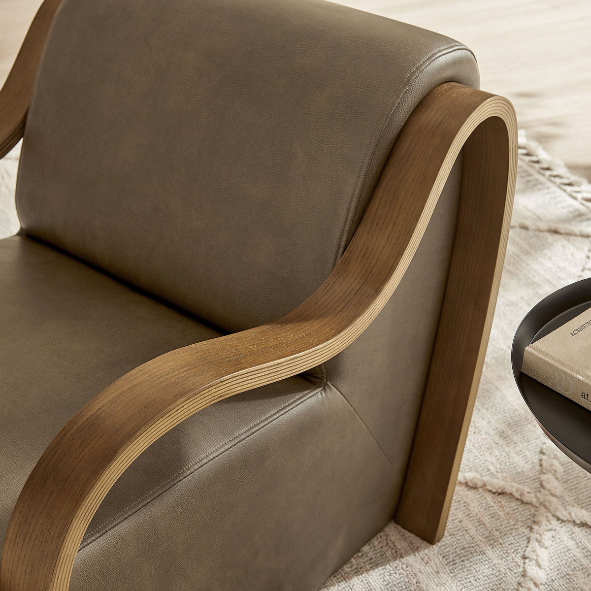 Atrium vegan leather accent armchair in brown with curved wood armrests on Tampa Home & Garden Store