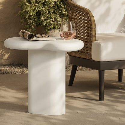 Elowen Outdoor Patio Side Table white round pedestal beside wicker chair with magazine on Tampa Home & Garden Store