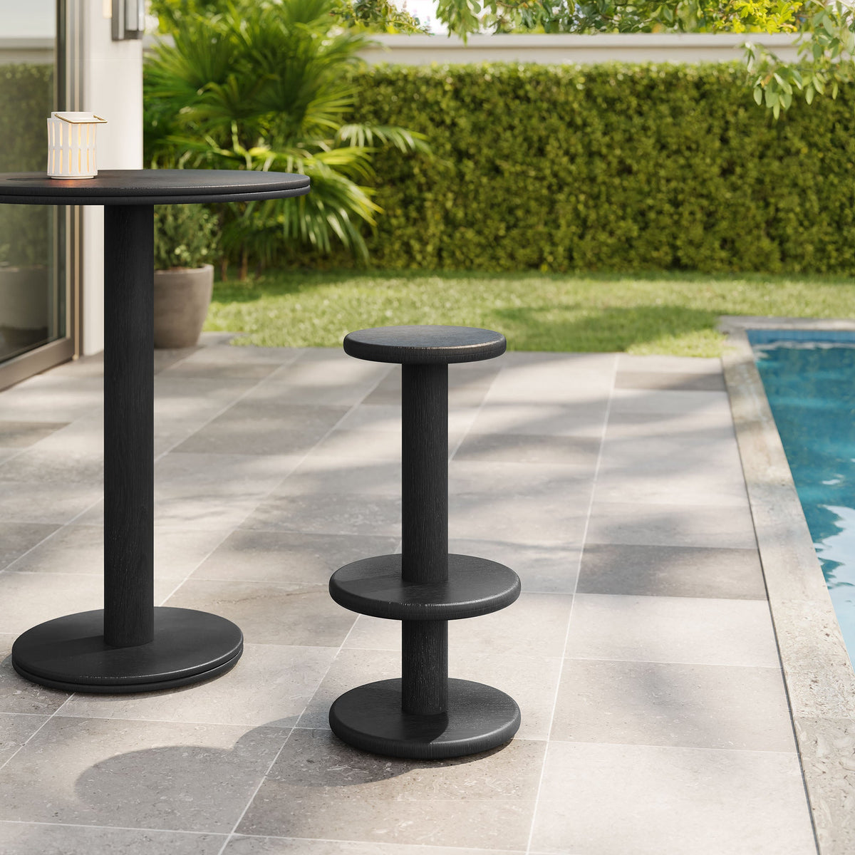 Neo 15-inch round indoor-outdoor wood bar stools set of two in black on patio by pool on Tampa Home & Garden Store