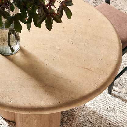 Tori 48-inch round dining table with speckled beige stone top and wood pedestal base on Tampa Home & Garden Store