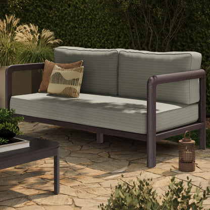 Kona outdoor teak wood loveseat with light gray cushions and decorative pillows on Tampa Home & Garden Store