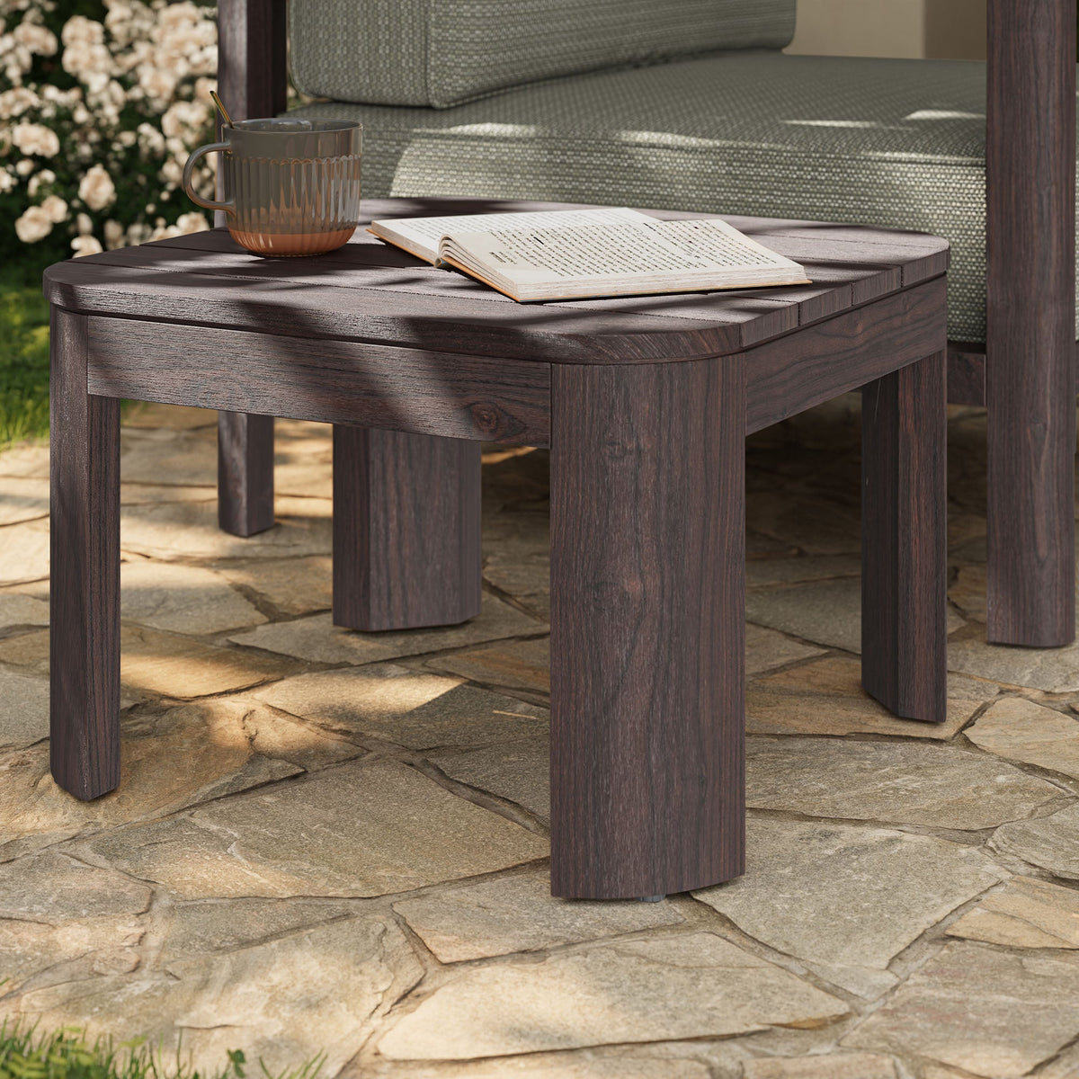 Kona outdoor teak wood side table by Modway in dark brown finish with a mug and open book on Tampa Home & Garden Store