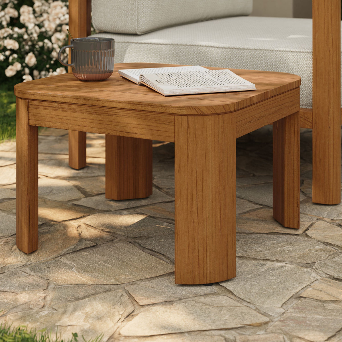 Kona outdoor teak wood side table by Modway with gradient mug and open book on patio on Tampa Home & Garden Store