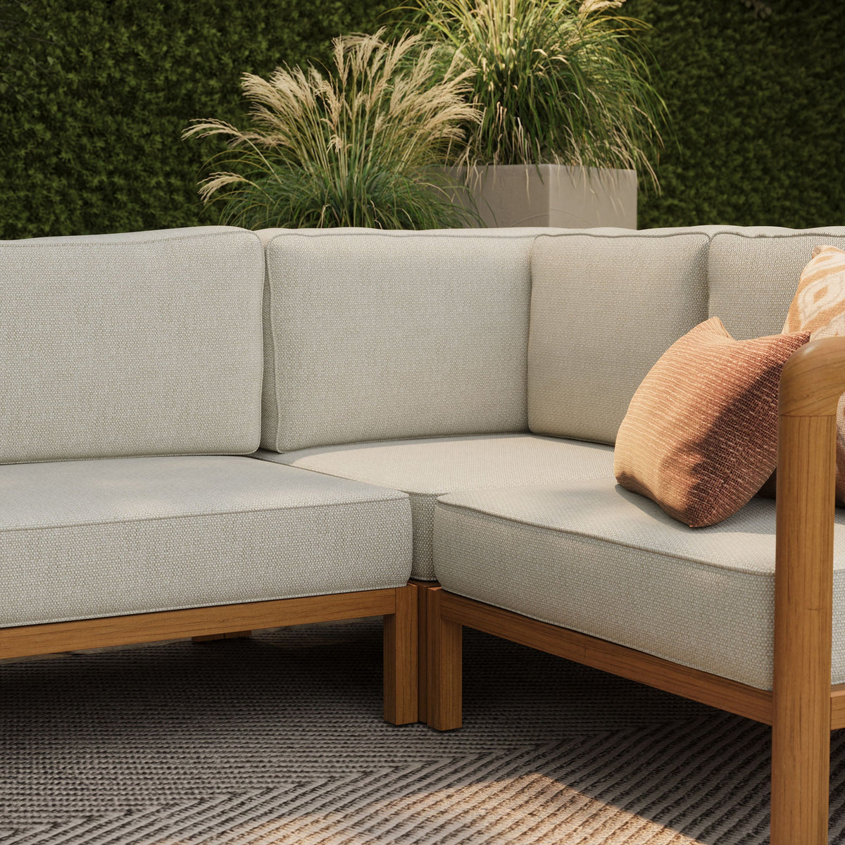 kona l-shaped outdoor teak wood modular sofa by modway, beige cushions with orange pillow on Tampa Home & Garden Store