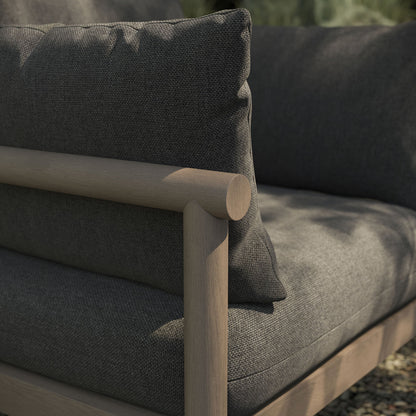 Eleni outdoor teak armchair with natural wood frame and dark gray cushion on Tampa Home & Garden Store