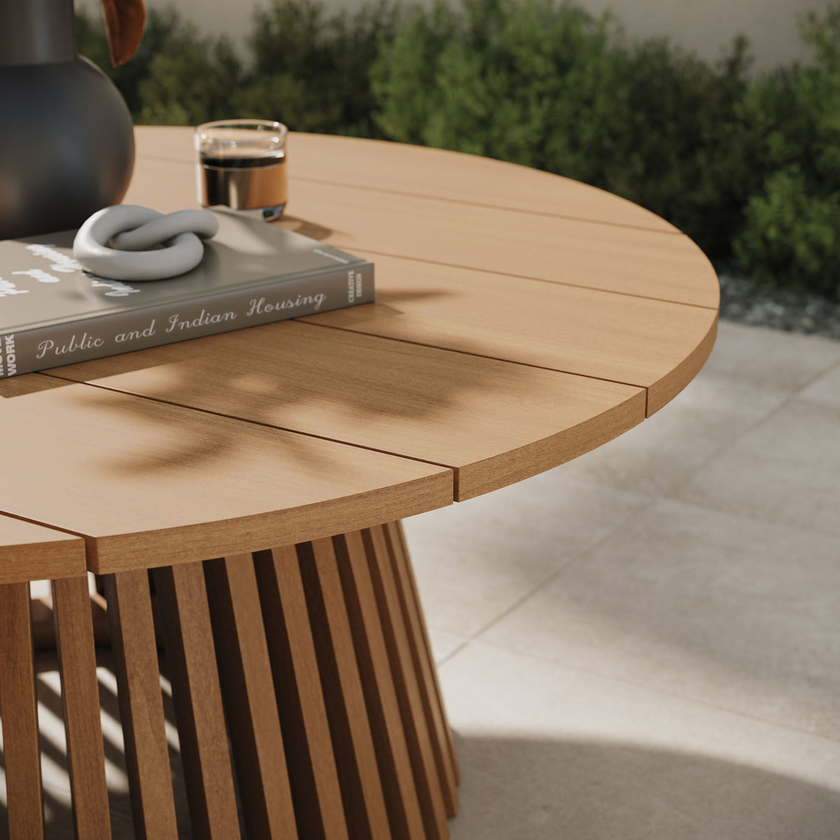 Lane Round Outdoor Teak Wood Coffee Table with slatted pedestal base on patio on Tampa Home & Garden Store