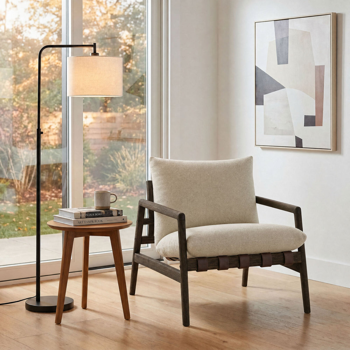 Nomi outdoor teak wood sling chair with beige cushion and dark wood frame in a modern living space on Tampa Home & Garden Store
