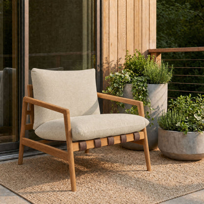 Nomi outdoor teak wood sling chair with beige cushions on a wooden deck on Tampa Home & Garden Store