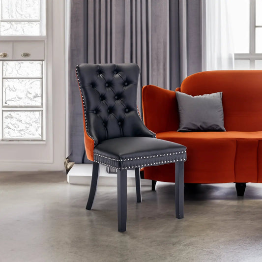Tufted Wood Dining Chair with black upholstery, orange side panels, nailhead trim on Tampa Home & Garden Store