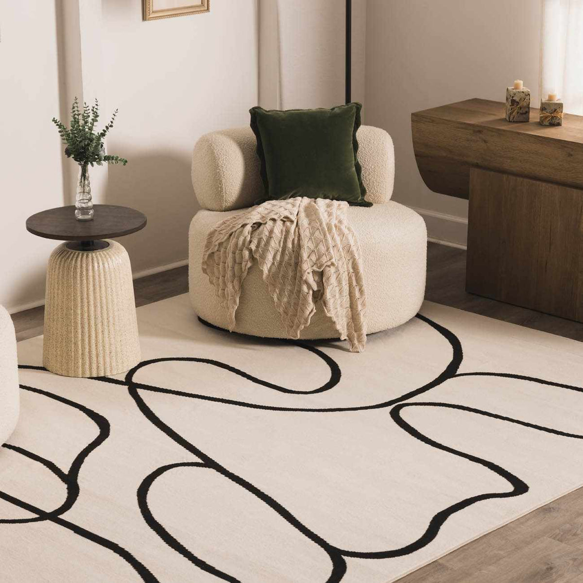 Eilir Modern Low Profile Boho Rug cream base with bold black abstract loops Boutique Rugs on Tampa Home & Garden Store