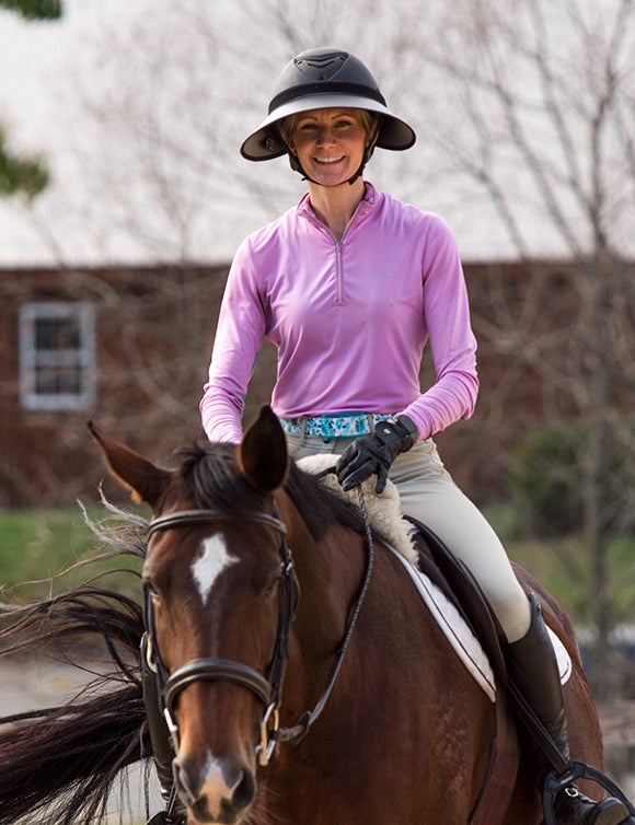 EquiVisor Sport sun visor, black brim with white underside, rider on horseback in pink top on Tampa Home & Garden Store