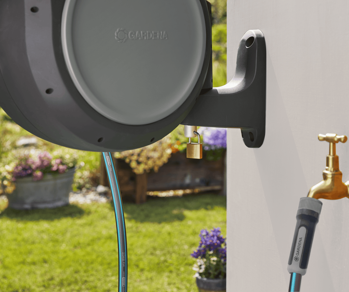 Gardena RollUp 50 ft retractable hose reel, wall-mounted, auto retracting with blue hose on Tampa Home & Garden Store