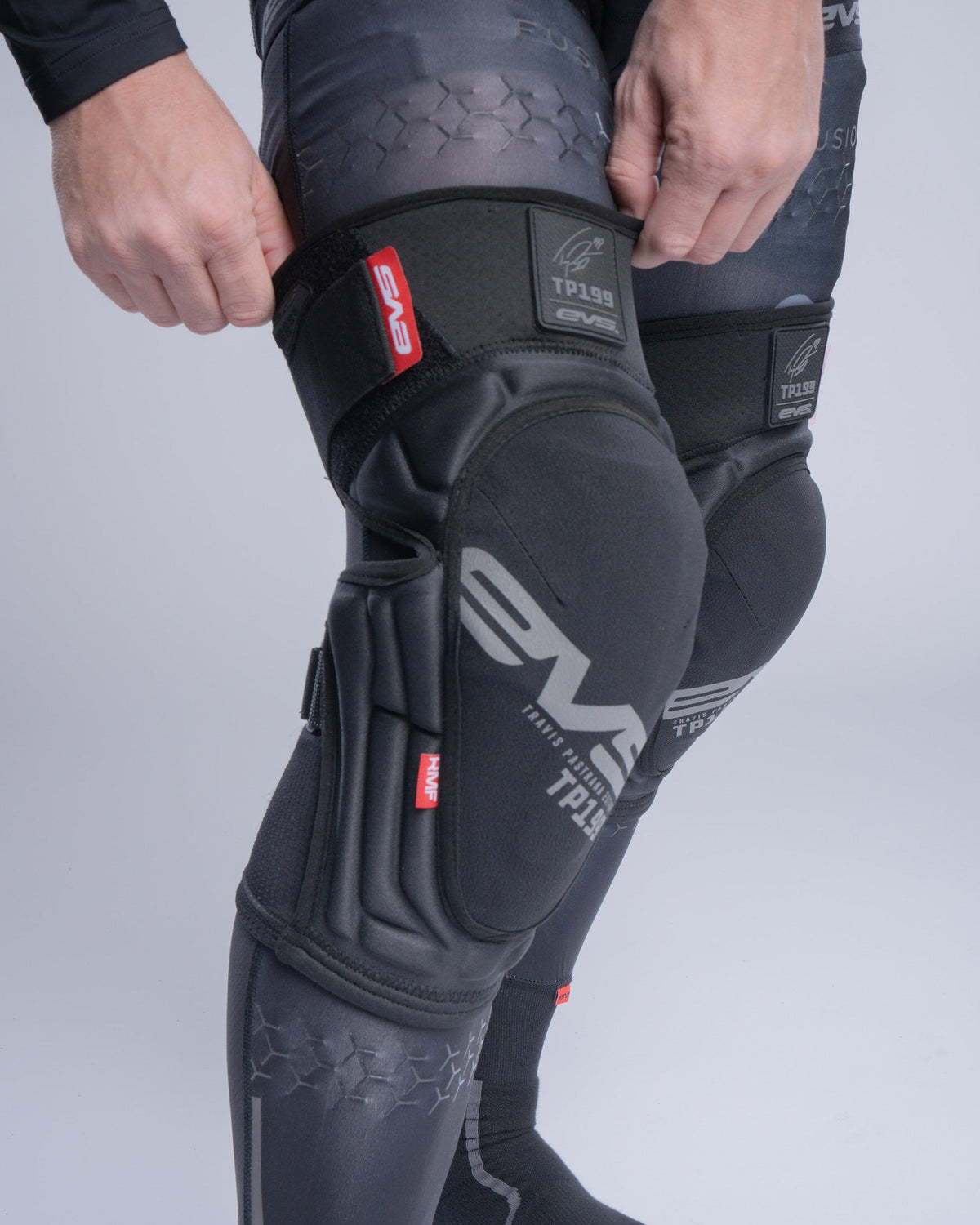 TP199 Lite Blackout Knee Guard EVS Sports black knee protection with red tag and Velcro on Tampa Home & Garden Store