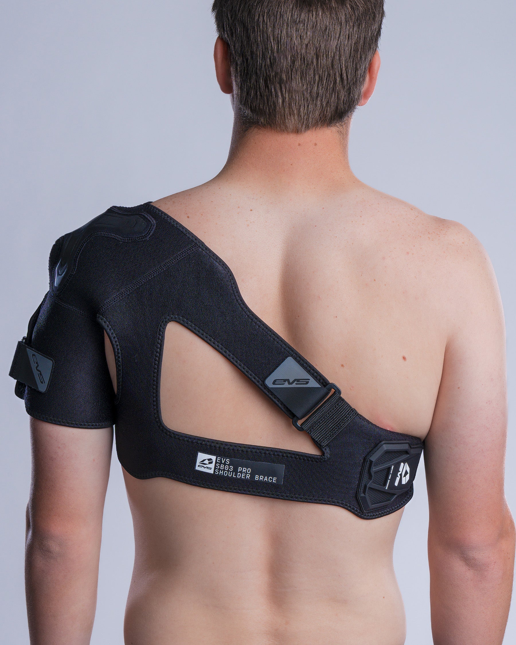 SB03 Pro Shoulder Brace by EVS Sports, black shoulder support with back strap and logo on Tampa Home & Garden Store