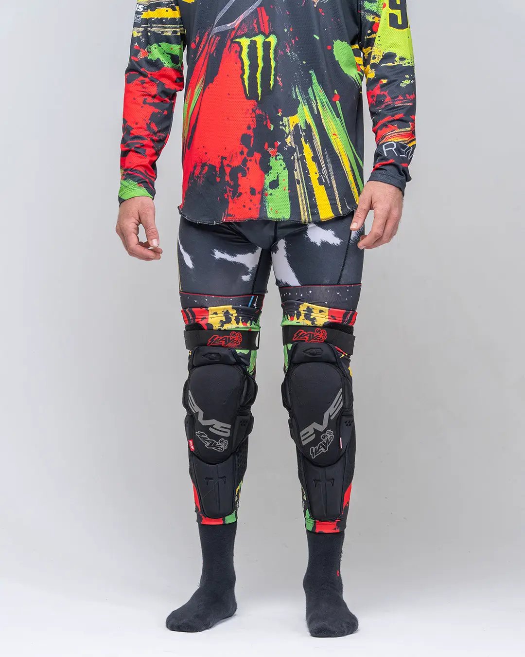 Slayco96 Explosion Knee Guard EVS Sports, black knee/shin guards with red-green-yellow accents pair on Tampa Home & Garden Store