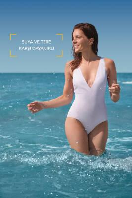 Bioderma Photoderm SPF50+ Sunscreen Cream ad with a woman in a white swimsuit at beach on Tampa Home & Garden Store