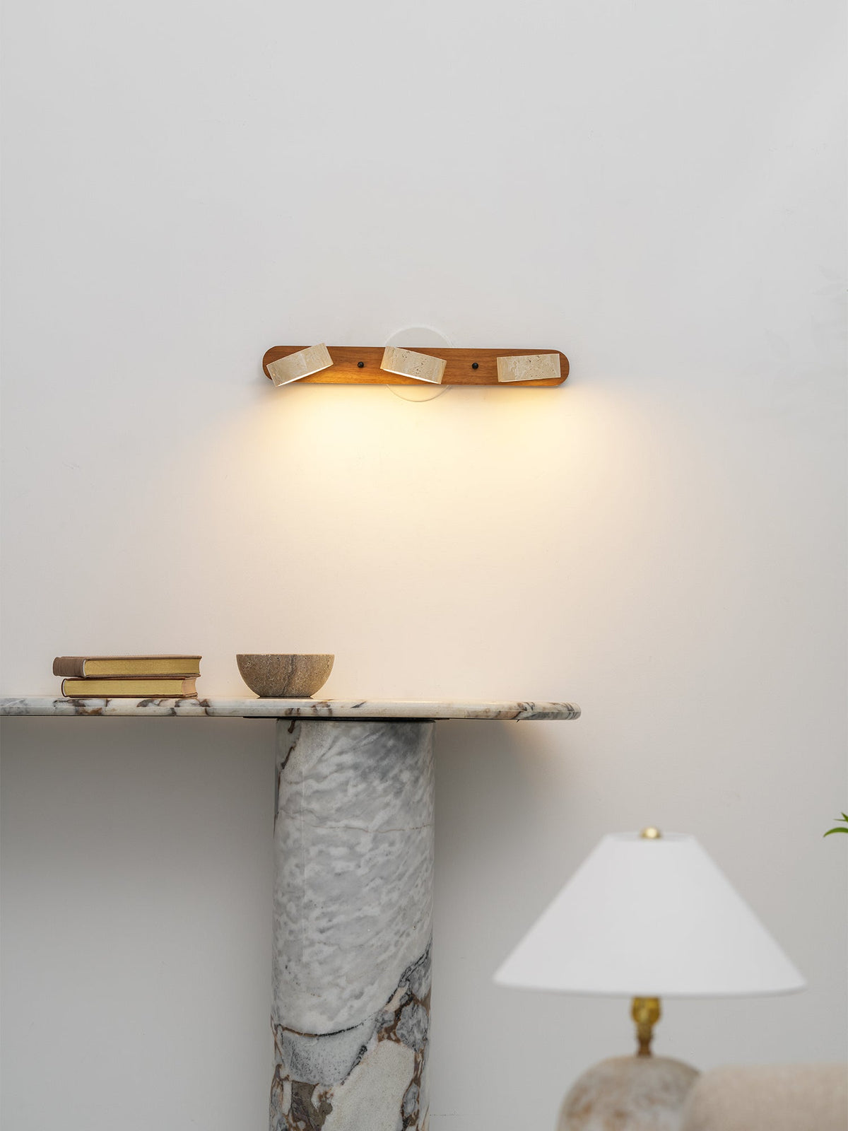 Travertine stone wall sconce with dimmable LED and natural wood accent by Moktan Sabai on Tampa Home & Garden Store