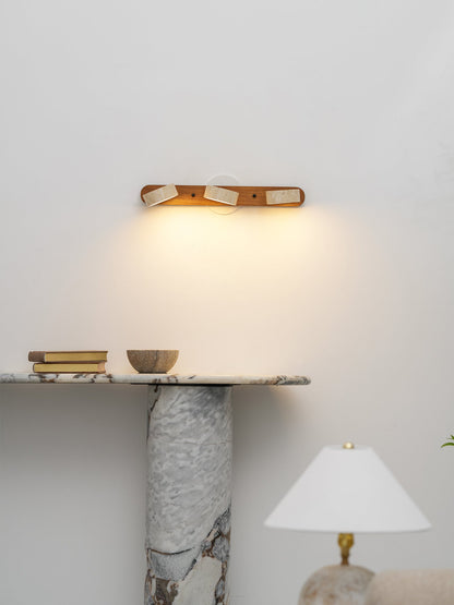 Travertine stone wall sconce with dimmable LED and natural wood accent by Moktan Sabai on Tampa Home & Garden Store