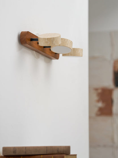 Travertine stone wall sconce with dimmable LED and wood base, three beige discs on Tampa Home & Garden Store