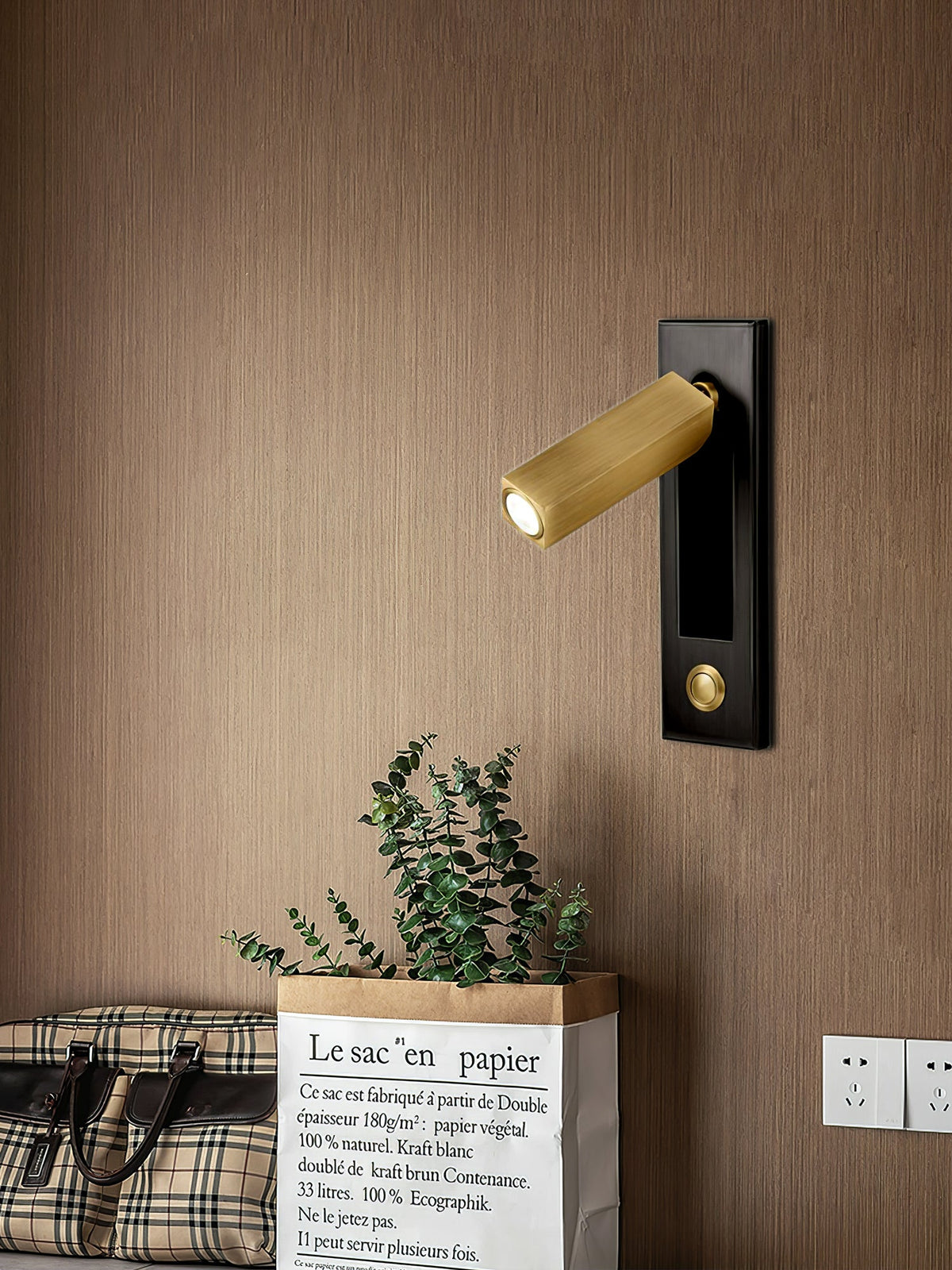 Bedside wall sconce with warm LED, brass gold cylinder on black backplate Moktan Sabai wall fixture on Tampa Home & Garden Store