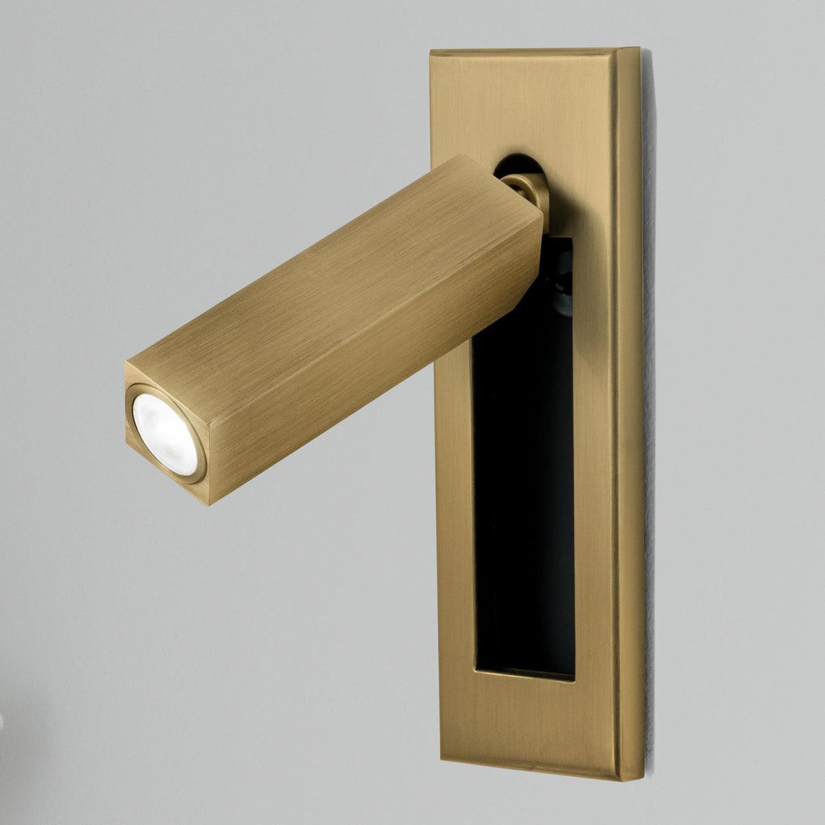 Moktan Sabai brass bedside wall sconce with fold-out arm and warm LED on Tampa Home & Garden Store